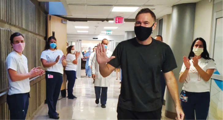 practice providers clapping at healed patient